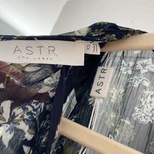 ASTR the label lined dress, asymmetrical hem, Comes with a navy slip insert.